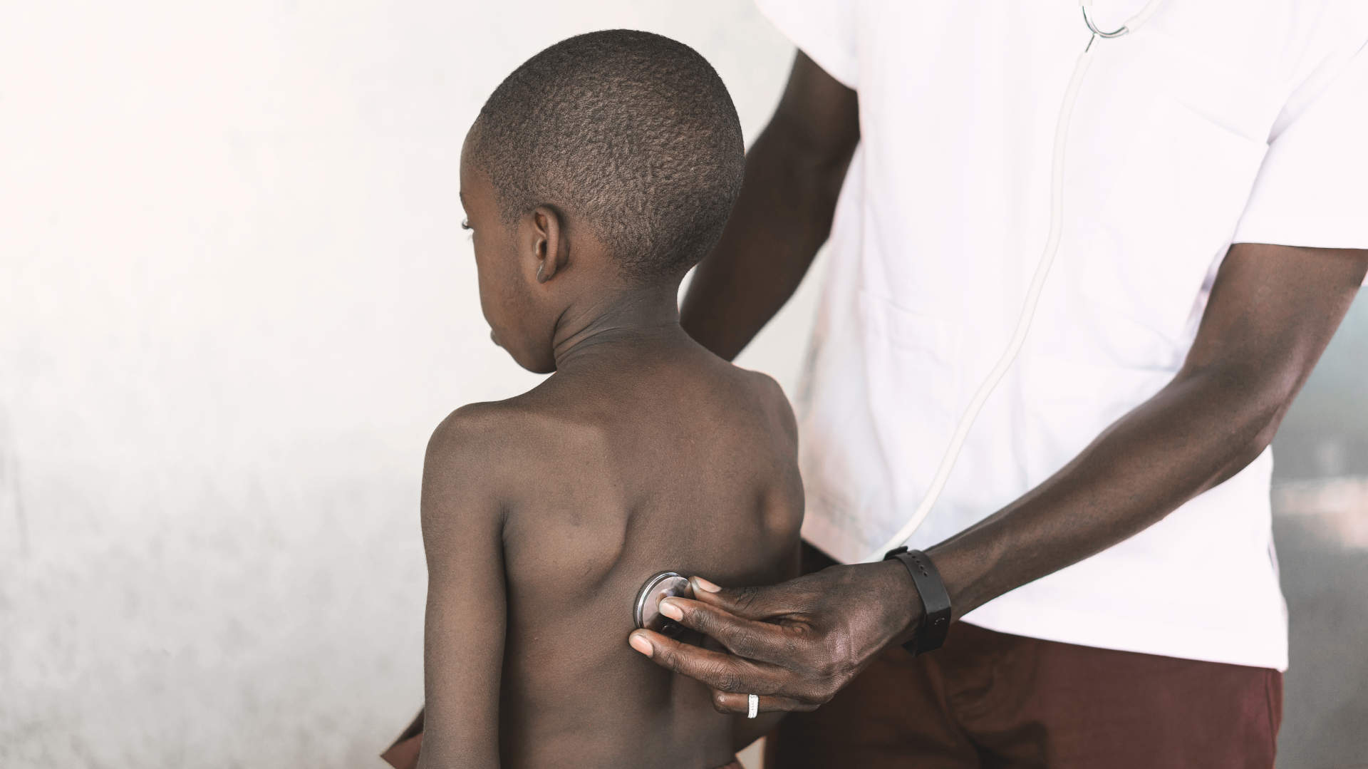 Ampoule of adrenaline being lifted from a drug tray