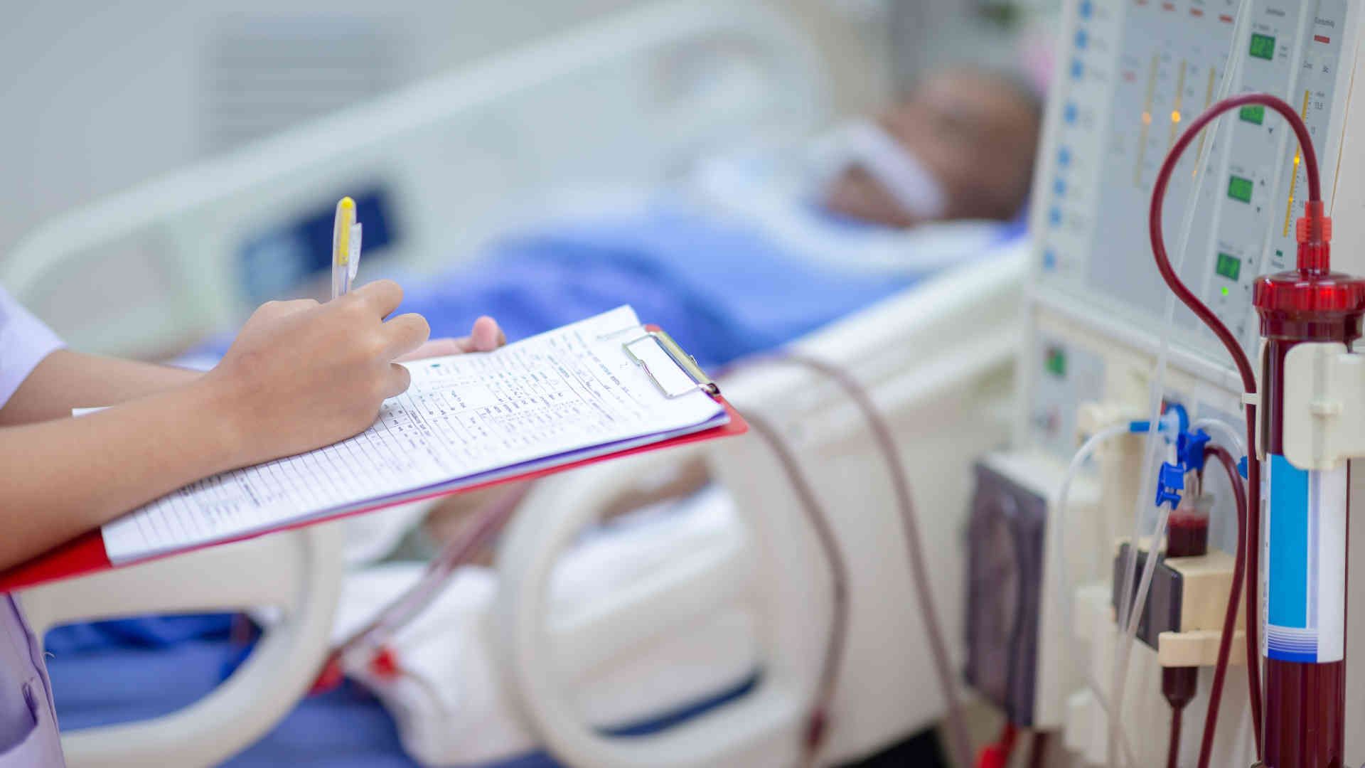 Nurse managing a CRRT machine in the ICU