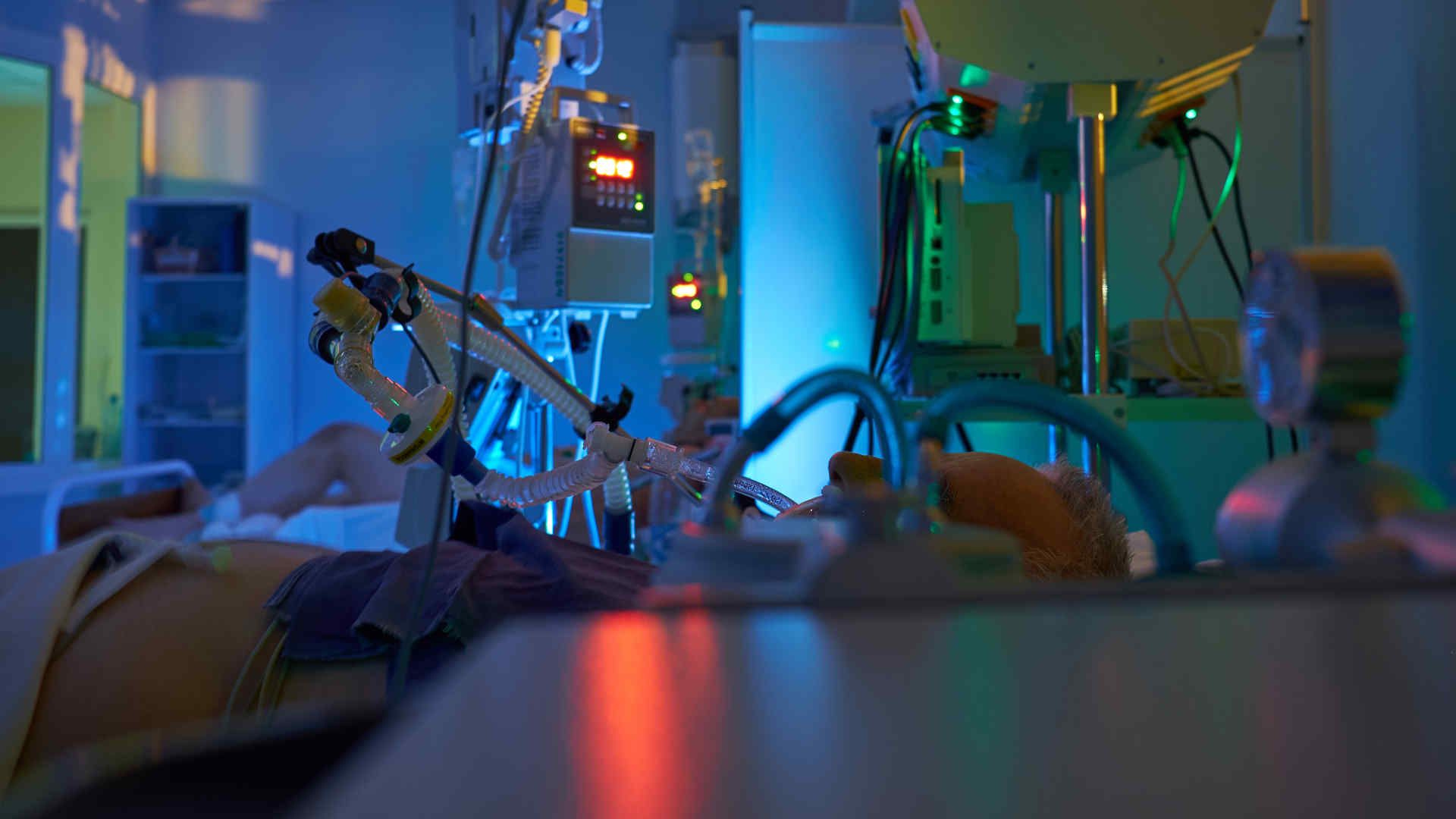 Ventilated patient in ICU at night